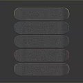 Multiple Colorful Skateboards with Colored Decks and White Wheels Stacked on Dark Background