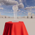 Decorative Ornament Set With Gold Silver Trophies On Red Draped Platform Against Blue Sky