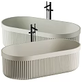 Two Modern Oval Bathtubs With Ribbed Design And Black Faucets 3d model