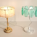 Two Stylish Table Lamps With Leaf Pattern Shades And Gold Silver Bases