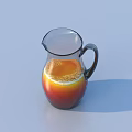 Refreshing Orange Drink in Transparent Glass Pitcher with Foam and Light Blue Background