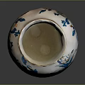 White Ceramic Vase Decorated With Blue And Orange Floral Patterns For Home Decor