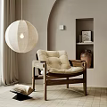Cozy Wooden Frame Lounge Chair With Beige Cushion And Linen Pendant Light In Minimalist Room