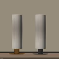 Two Modern Floor Lamps with Beige Shades Gold Black Bases Light Wall Wooden Floor