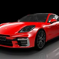 Red Sports Car With Modern Sleek Body And Black Alloy Wheels Design