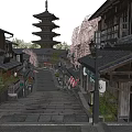Traditional Japanese Commercial Street With Historic Buildings Cherry Blossom Trees And Stone Pavement