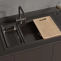Modern Kitchen Sink Area With Black Countertop Wooden Cutting Board And Wine Glass