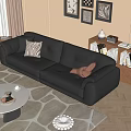 Black Leather Double Sofa With Striped And Brown Pillows In Living Room With Bookshelf And Decorative Paintings