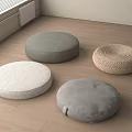 Comfortable Round Floor Cushions in Gray White and Woven Beige on Wooden Floor