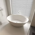 Modern Minimalist Bathroom Interior Featuring Freestanding Round White Bathtub And Window Blinds