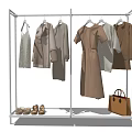 Metal Clothing Rack Displaying Coats Dresses Shirts With Shoes And Handbag