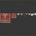 Household Items With Red Patterned Carpets And Hanging Different Style Clothes Pants Shirts