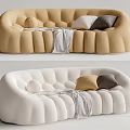 Modern Multi Seater Sofa In Beige And White With Ribbed Design Pillows And Blanket