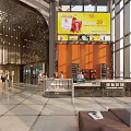Modern Cinema Lobby Featuring Decorative Columns Warm Lighting And People Walking Through