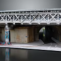 Urban Steel Truss Bridge With Concrete Support Underpass Bicycles And Water Reflection