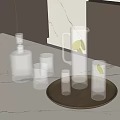 Whiskey Bottle and Glasses with Ice Cubes Pitcher Lemon Slices on Brown Tray White Countertop