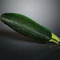 Fresh Green Zucchini Whole Ripe Vegetable with Smooth Skin on Dark Reflective Surface