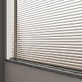 Light Colored Venetian Blinds Covering Window With Dark Sill In Bright Interior Room