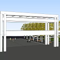 White Frame Entrance Gate With Yellow Trees Palm Trees And Gray Paved Ground