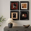 Four Framed Abstract Paintings on Wall with Table Lamp and Plant Decor