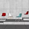 Colorful Modern Dining Chairs With Metal And Wooden Legs On Step Display Against Grey Wall