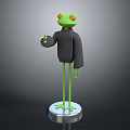 Green Frog Sculpture with Black Clothing Red Eyes and Thumbs Up Gesture on Silver Base
