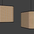 Two Bamboo Pendant Lights with Hollow Out Design and Warm Illumination Against Grey Wall