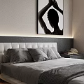 Modern Double Bed With Soft Headboard Gray Bedding Nightstand Books And Black White Wall Art