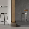 Poliform Modern Bar Stools With Black Seat And Wooden Backrest Against Gray Wall And Golden Column