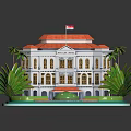 Traditional Multi Story Building With Red Roof And Palm Trees Around Circular Lawn Area