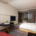 Hotel Guest Room With White Bed Linens Three Circular Wall Decor And Wooden Headboard