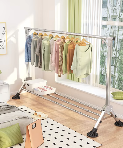 Metal Clothes Rack Hanging Various Colored Clothes With Storage Box On Wooden Bedroom Floor 3d model