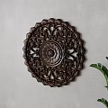 Dark Brown Wooden Circular Wall Hanging With Carved Lotus Patterns On Light Gray Wall