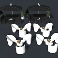 Outdoor Sofa Set With White Chairs Tables Umbrellas And Green Plants In Patio