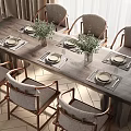 Wooden Dining Table Set With Upholstered Chairs Plates Placemats And Green Plants