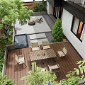 Courtyard Garden With Wooden Deck Dining Table Chairs Lush Greenery Water Feature And Fire Pit