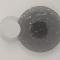 Two Circular Gray Toned Wall Decor With Textured Matte Finish Surfaces