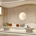 Modern Lounge Area with Curved Sofa Circular Moon Lamp Small Round Tables and Light Walls