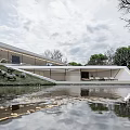 Modern Detached Villa With Sleek Roof Waterfront Reflection And Lush Lawn