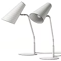 Modern Black And White Table Lamp With Conical Shade Silver Arm And Illuminated Light