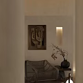 Rattan Leisure Chair in Cozy Interior with Beige Wall Abstract Painting and Black Vase
