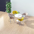 Modern Round Table And Chairs Set With Yellow Pink Seats Potted Plant On Wooden Floor