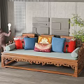 Chinese Style Wooden Multi Seater Sofa With Colorful Cushions Monkey Sculpture And Green Plant