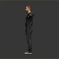 Man with outstretched arms wearing blue T-shirt black jacket canvas shoes against gray background