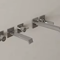 Modern Silver Faucet With Smooth Glossy Finish Mounted On Light Colored Wall