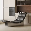 Black Leather Lounge Chair In Modern Kitchen With Light Cabinets Wooden Wall And Oven