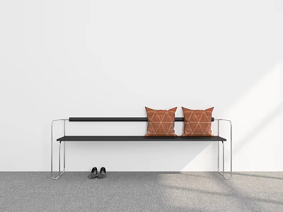 Black Bench with Two Orange Cushions and Black Shoes Against White Wall and Gray Floor 3d model