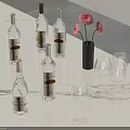 Ginseng Bottles With Pink Flowers In Black Vase And Clear Wine Glasses On White Countertop