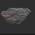 Natural Layered Rock Formation With Dark Brown Textured Surface And Geological Patterns