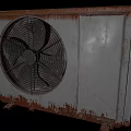 Old Rusted Air Conditioner Fan With Metal Casing And Rotating Blades